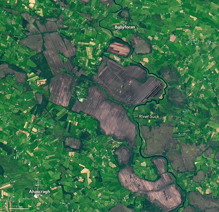 An image of the land from above, with a mixture of brown and green areas